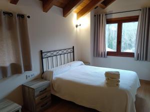 Postel nebo postele na pokoji v ubytování Rural Berrós