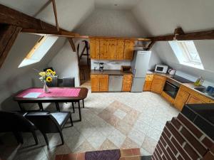 a kitchen with a table and a dining room at Lausitzhof in Hoyerswerda