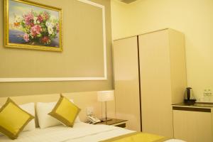 Rúm í herbergi á Hotel Hoang Minh Chau
