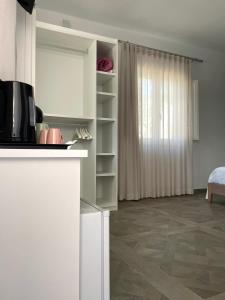 a room with a kitchen and a living room at B&B SoleLuna in Lampedusa +37 photos