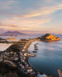 an aerial view of a beach at sunset at Il Panorama di Ercole in Monte di Procida
