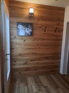 a wooden wall in a hallway with a picture on it at Haus Wallinger in Abtenau