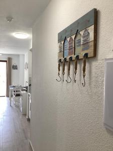 a wall with a painting of houses on it at Estupendo Estudio en Castle Harbour Los Cristianos in Los Cristianos