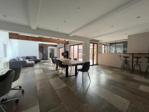 a large living room with a table and chairs at Entre Mer et Vignes Perpignan in Perpignan