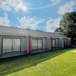 a house with a green lawn in front of it at 473 On Cliff in Pretoria
