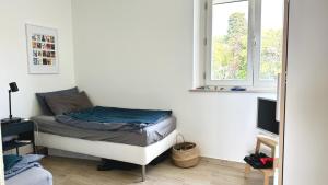 a small bedroom with a bed and a window at S334 - Sirolo, meraviglioso trilocale panoramico in Sirolo