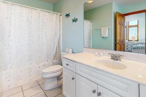 a bathroom with a sink and a toilet and a mirror at Lapha Amanzi #6-PA in Avon +28 photos