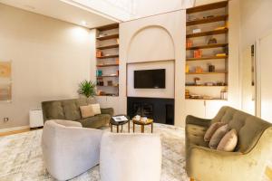 Uma TV ou centro de entretenimento em Avenida Boutique Hotel