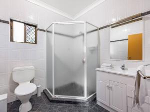 a bathroom with a shower and a toilet and a sink at 1 Bedroom Comfy Unit Sleep 3 close to mall and bus in Brisbane