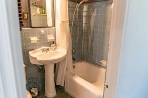 a bathroom with a sink and a toilet and a tub at Hidden Gem Off Atlantic Ave, Just Steps From Beach in Delray Beach +29 photos