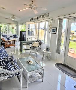 a living room with a couch and a table at Peaceful Lakeside Retreat in Winter Haven