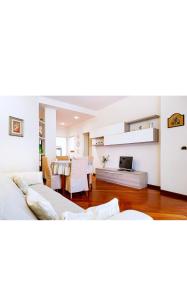 a living room with two beds and a table at Dimora: A casa di Pier in Bari