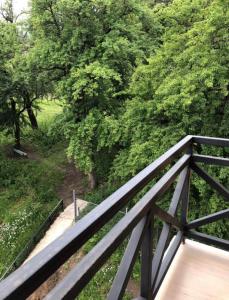 a wooden bridge with trees in the background at Bakuriani Park Recidence Apartment in Bakuriani