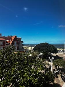 a view of a street with trees and a building at Grand Hôtel Richelieu in Arcachon