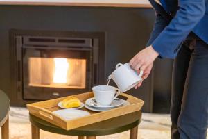 Comodidades para preparar café e chá em Avenida Boutique Hotel