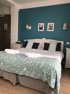 Postel nebo postele na pokoji v ubytování Hotel Les Embruns