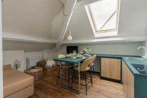 a kitchen and living room with a table and chairs at Palazzo Quantum 1 in Milan