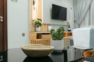 TV o dispositivi per l'intrattenimento presso Kashco Apartments Wuse 2 Abuja