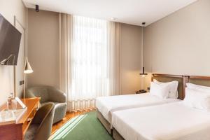 Cama ou camas em um quarto em Avenida Boutique Hotel