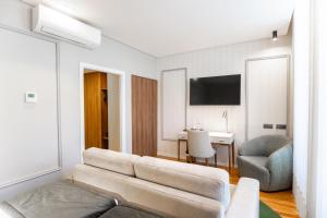 Uma TV ou centro de entretenimento em Avenida Boutique Hotel