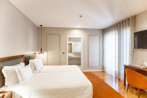 Cama ou camas em um quarto em Avenida Boutique Hotel