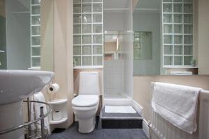 a bathroom with a toilet and a sink at ※ Spacious, Central Bath Apartment ※ in Bath