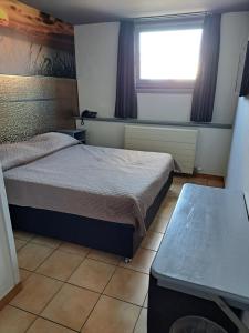 Postel nebo postele na pokoji v ubytování Le New Matinal
