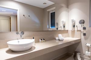 Um banheiro em Avenida Boutique Hotel