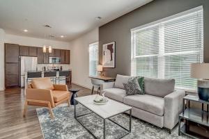 a living room with a couch and a table at Landing at San Marco Promenade - 1 Bedroom in San Marco in Jacksonville