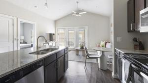 a kitchen with a sink and a counter top at Landing at Mission Hill - 1 Bedroom in New Braunfels in New Braunfels