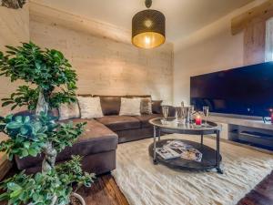 a living room with a couch and a table at Appartement Villard-de-Lans, 2 pièces, 5 personnes - FR-1-548-43 in Villard-de-Lans