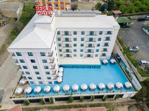 an overhead view of a hotel building with a swimming pool at Berlin Suite Hotel Trabzon in Trabzon