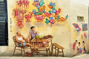 a mural of a man and a woman sitting at a table at Rucksack Inn Temple Street in Singapore
