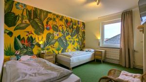 Postel nebo postele na pokoji v ubytování WannerHus Hotel