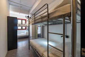 a couple of bunk beds in a room at Rucksack Inn @ Temple St in Singapore