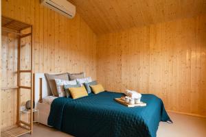 a bedroom with a bed in a wooden wall at Host Wise - Spacious Comfortable House Pool in Amarante