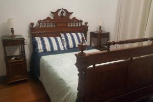 Tempat tidur dalam kamar di Mansão Tiradentes com piscina