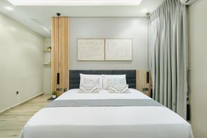 Postel nebo postele na pokoji v ubytování Kashco Apartments Wuse 2 Abuja + 37 fotografií