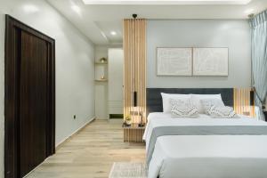 Letto o letti in una camera di Kashco Apartments Wuse 2 Abuja