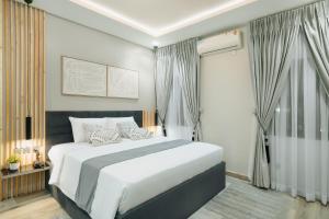 Letto o letti in una camera di Kashco Apartments Wuse 2 Abuja