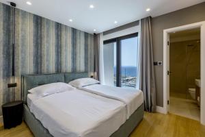 Postel nebo postele na pokoji v ubytování Luxury Villa Mare, direkt am Strand + 92 fotografií