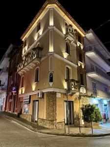 a building on the corner of a street at night at B&B Fiorentino in Lamezia Terme