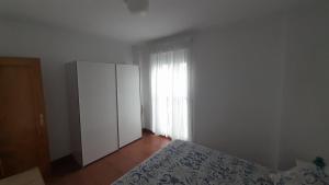 Giường trong phòng chung tại El Sardinero