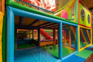 a play room with a slide and play equipment at Ushuaia, The Mountain Hotel in Arinsal