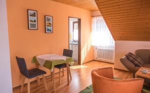 a dining room with a table and chairs at Haus Schwörer in Hagnau