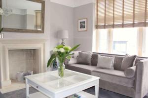 a living room with a couch and a coffee table at ※ Lovely Central Bath House- with Parking ※ in Bath