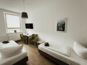 Postel nebo postele na pokoji v ubytování Hotel am Stadtpark Nordhausen
