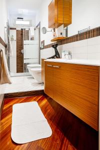 a bathroom with a sink and a toilet and a tub at Dimora: A casa di Pier in Bari +13 photos