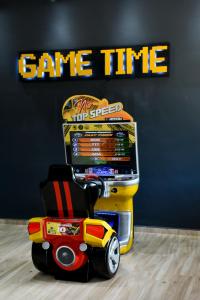 a toy car is parked in front of a game cart at Hotel Fazenda Vista Alegre in São Lourenço