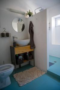 a bathroom with a sink and a toilet at Гагинската къща in Martinovo